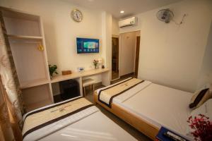 TV a/nebo společenská místnost v ubytování Huynh Duc 2 Hotel