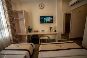 Postel nebo postele na pokoji v ubytování Huynh Duc 2 Hotel