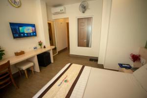 TV a/nebo společenská místnost v ubytování Huynh Duc 2 Hotel