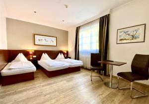 En eller flere senger på et rom på Hotel Turnerwirt