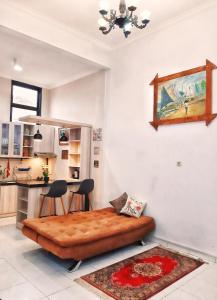 a living room with a bed in a kitchen at Rumah Sorai in Batu +13 photos