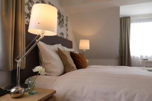 Postel nebo postele na pokoji v ubytování Hotel Weinlaube