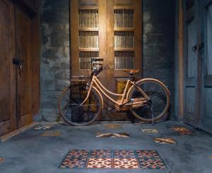 a bike parked in front of a building at Omah minggir in Sleman