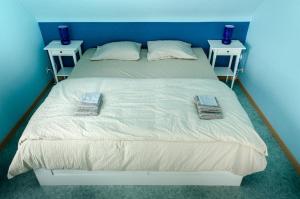 Säng eller sängar i ett rum på De Wilgoren