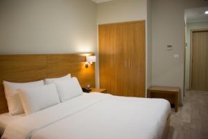 Postel nebo postele na pokoji v ubytování Hotel Jaroal