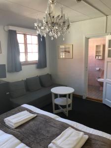 Letto o letti in una camera di Värdshuset Hwitan
