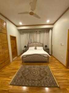 Кровать или кровати в номере ISLE OF HIGHLAND TOURS Guest House