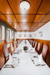 a large conference room with a long table with chairs at Landgasthaus Pfahl in Wershofen