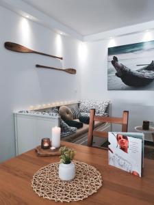 a dining room with a table with a candle on it at Apartments Vela in Piran