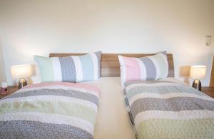 A bed or beds in a room at Ferienwohnung Kienast