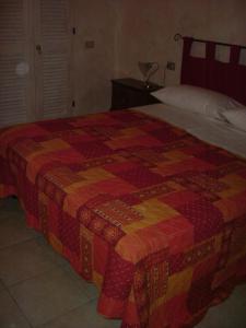 Postel nebo postele na pokoji v ubytování Agriturismo Cascina Gilli