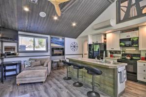a kitchen and living room with a bar and a couch at Floating Home on Columbia River with Provided Kayaks in Vancouver