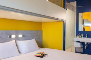 Postel nebo postele na pokoji v ubytování ibis budget Amsterdam Airport