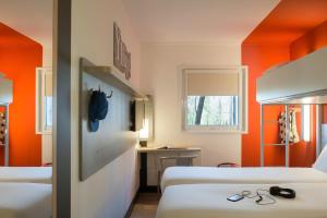 Postel nebo postele na pokoji v ubytování ibis budget Amsterdam Airport