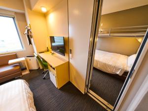 Postel nebo postele na pokoji v ubytování Super Hotel Kashima