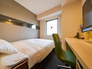 Postel nebo postele na pokoji v ubytování Super Hotel Kashima