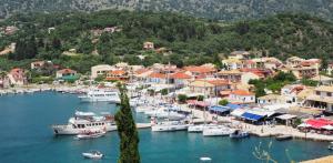 a group of boats docked in a harbor at Sivotahomes-luxury in Syvota