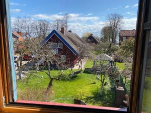 a window view of a house with a yard at K8-5 Apartments in Nida