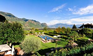 an aerial view of a resort with mountains in the background at Hotel Garni Sonngart in Andrian