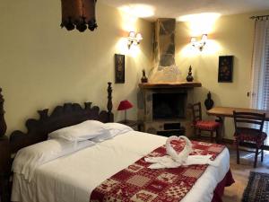 Postel nebo postele na pokoji v ubytování Garnì Astoria Hotel & SPA