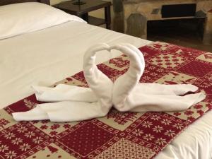 Postel nebo postele na pokoji v ubytování Garnì Astoria Hotel & SPA