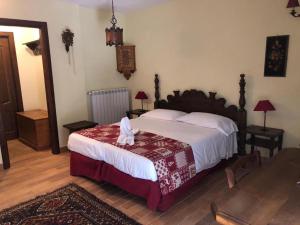 Postel nebo postele na pokoji v ubytování Garnì Astoria Hotel & SPA