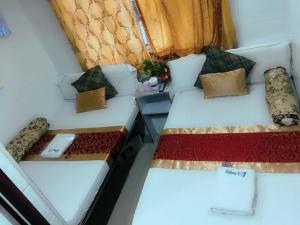 Voodi või voodid majutusasutuse Pay-Less Guesthouse (7/F A9) toas