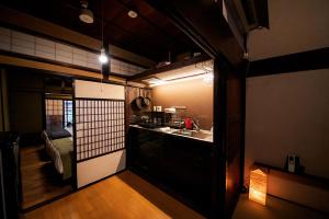 a small kitchen with a sink and a counter at Baiyaku-yadoya Yamaki #HH4 in Toyama
