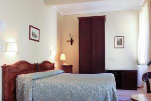 Cama ou camas em um quarto em Villa La Mirabella