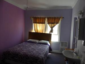 Postel nebo postele na pokoji v ubytování Hotel del Flores