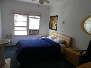 Postel nebo postele na pokoji v ubytování Hotel del Flores