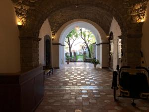 an archway leading into a building with a courtyard at Maison De Lucia in Meta