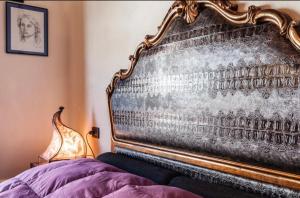 A bed or beds in a room at Casa Costanza