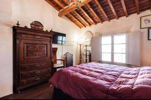 A bed or beds in a room at Casa Costanza