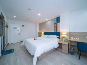 Ένα ή περισσότερα κρεβάτια σε δωμάτιο στο 7Days Premium Changsha West Bus Station Meixi Lake East Subway Station +37 φωτογραφίες