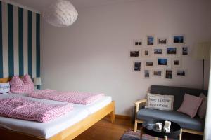 Ein Bett oder Betten in einem Zimmer der Unterkunft Stadtflucht Lüneburg: Ferienwohnungen Innenstadt
