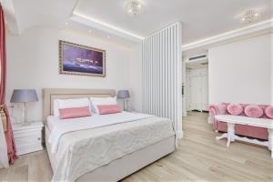 Postel nebo postele na pokoji v ubytování Hotel Libertas