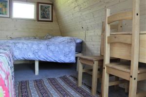 Poschodová posteľ alebo postele v izbe v ubytovaní Rum Bridge "Patsy's" Family Glamping Pod