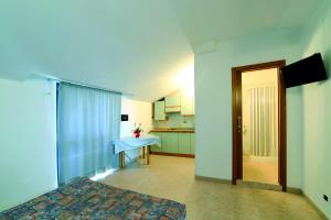 Säng eller sängar i ett rum på Hotel Residence Margherita