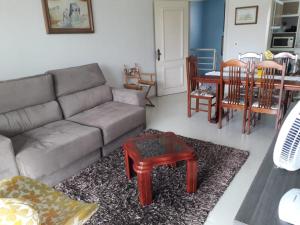 a living room with a couch and a table at Serra Gaúcha Uva e Vinho in Bento Gonçalves +9 photos