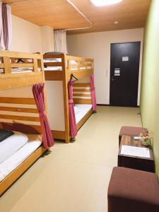 Postel nebo postele na pokoji v ubytování Hilo Hostel