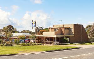 a large building with a clock on the front of it at Flinders Cove Motel in Flinders