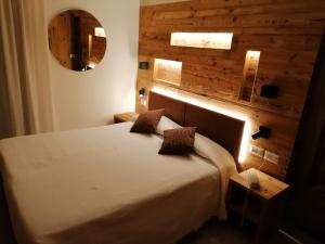 Rúm í herbergi á Albergo Silvana