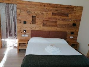 Rúm í herbergi á Albergo Silvana