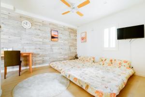 Letto o letti in una camera di サンライズハワイ