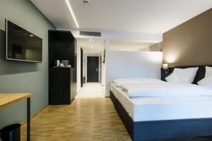 Letto o letti in una camera di Montfort - das Hotel