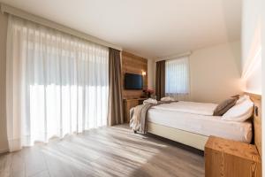 Postel nebo postele na pokoji v ubytování Hotel Ariston Garden & Spa