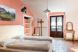 Giường trong phòng chung tại Albergo Locanda Mistral