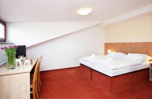 Postel nebo postele na pokoji v ubytování Hotel Panska Licha