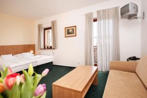 Postel nebo postele na pokoji v ubytování Hotel Panska Licha